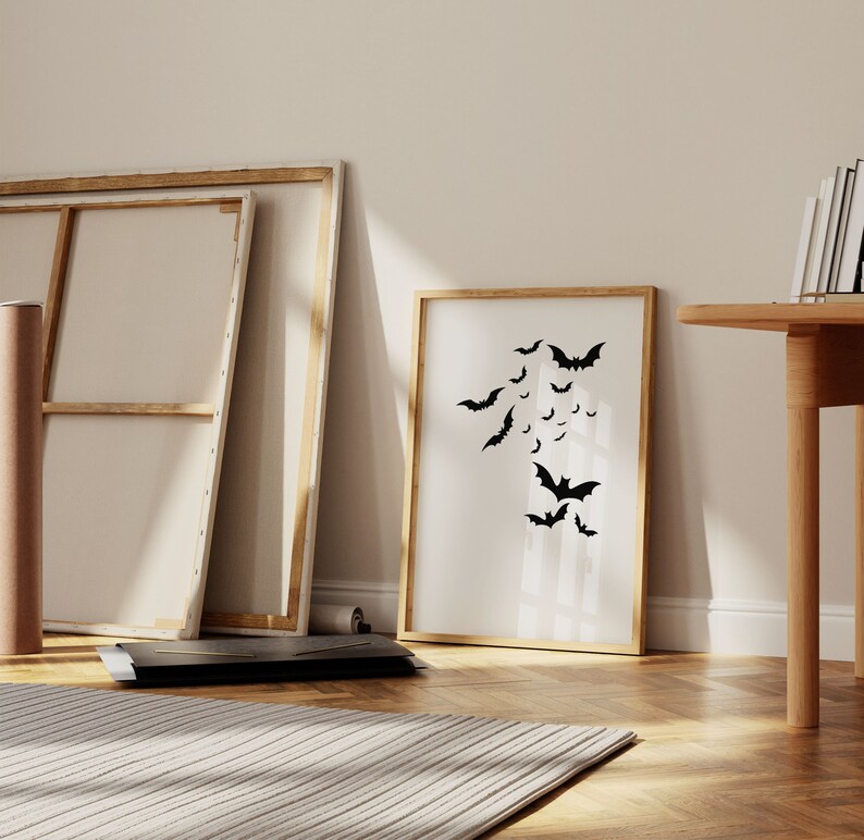 Printable artwork of black bats flying on white background