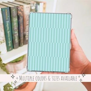 May include: A rectangular case with a mint green and light blue striped pattern. The case is held in a hand and has a silver frame. The text "MULTIPLE COLORS & SIZES AVAILABLE" is displayed at the bottom.