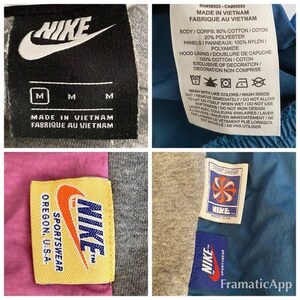 May include: A gray Nike sweatshirt with a black tag that reads "Made in Vietnam, Fabrique au Vietnam". The tag also has the Nike logo and the size "M".