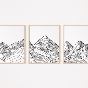 Może przedstawiać: Zestaw trzech czarno-białych grafik liniowych przedstawiających abstrakcyjne krajobrazy górskie. Każda grafika przedstawia stylizowane pasmo górskie z zakrzywionymi liniami.