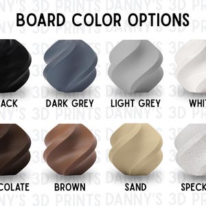 May include: A grid of eight spherical objects with a twisted, spiraled texture, labelled BOARD COLOUR OPTIONS. Colours include black, dark grey, light grey, white, chocolate, brown, sand, and a speckled finish, all arranged in two rows of four.