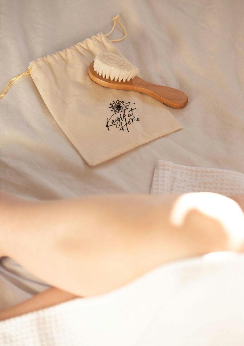 Kayle at Home facial dry brush, showing off its natural wooden handle and fine bristles for exfoliating delicate facial skin.
