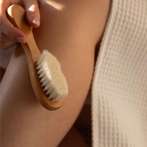 Close-up of a Kayle at Home facial dry brush, featuring natural bristles for effective yet gentle facial care.