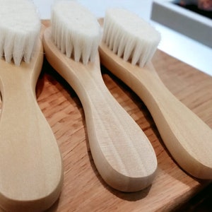 Kayle at Home facial dry brush, showing off its natural wooden handle and fine bristles for exfoliating delicate facial skin