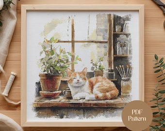 May include: A framed cross-stitch pattern featuring a ginger and white cat resting on a windowsill. The scene includes potted plants, a window, and the text "PDF Pattern" on a circular label. The artwork has a watercolor style.