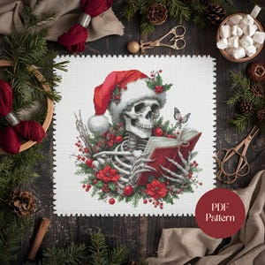 Christmas Skeleton Cross Stitch Pattern – Gothic Holiday PDF | Santa Hat Skeleton with Poinsettias and Book