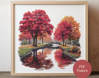 May include: Framed print of a park scene with a river reflecting the vibrant red and orange autumn trees. A small wooden bridge crosses the water. The print is in a light brown frame. A red circle with the text "PDF Pattern" is in the lower right corner.