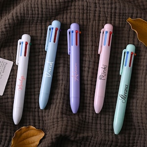 May include: Five multi-colored pens with personalized names:  "Molly", "David", "Aiden", "Rinki", and "Aavana".