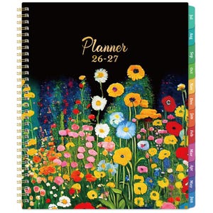 May include: A spiral-bound planner with a black cover featuring a colourful floral design. The cover has the word "Planner" in gold script, with "26-27" below it. The planner has monthly tabs on the right side.