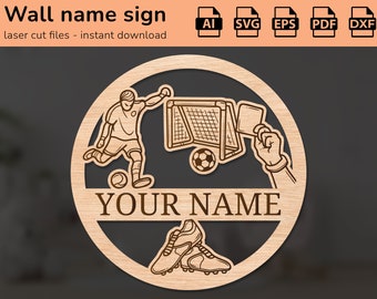 May include: A laser cut wooden sign featuring a soccer player, a goal, a soccer ball, and a referee's card. The sign has the text "YOUR NAME" in a decorative font.