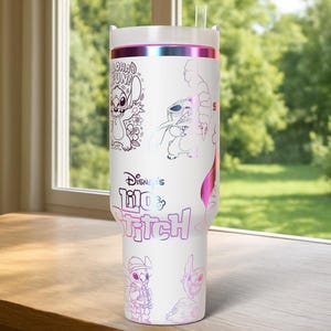 May include: White tumbler featuring multiple illustrations of Stitch from Disney's Lilo & Stitch, with the text "Aloha Fun" and "Disney's Lilo & Stitch". The tumbler has a white lid and a pink and purple iridescent band.