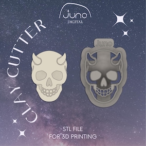 May include: Two 3D printable STL files for clay cutters. The cutters are shaped like a skull with horns. One cutter is white and the other is gray. The text "Juno" appears on the image.