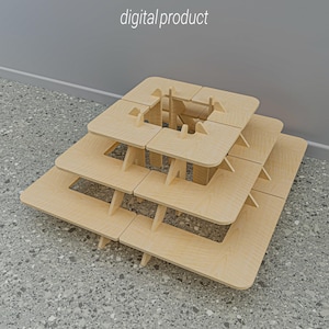 Puede incluir: Estructura de madera en capas con un diseño cuadrado, con secciones recortadas y vigas de soporte. El texto "digital product" está en la esquina superior izquierda. La estructura es de madera de color claro y se encuentra sobre una superficie gris moteada.