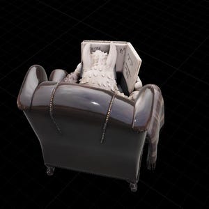 May include: A figurine of a creature with white fur reading a book while seated in a dark brown armchair. A plaid blanket is draped over the arm of the chair. The book has text on the pages.