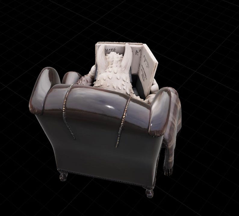 May include: A figurine of a creature with white fur reading a book while seated in a dark brown armchair. A plaid blanket is draped over the arm of the chair. The book has text on the pages.