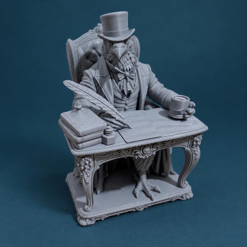 May include: A grey monochromatic figurine of an anthropomorphic bird wearing a top hat, cravat, and formal jacket, seated at an ornate desk. The bird holds a mug, with a quill pen, inkwell, and a stack of books resting on the desk surface.