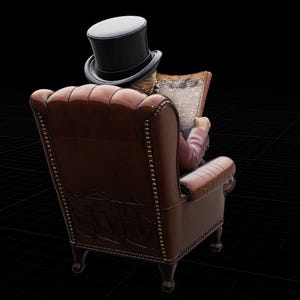 May include: A figurine of a figure wearing a black top hat, seated in a brown leather armchair with nailhead trim, reading a newspaper. The chair features a high, tufted back and carved wooden legs, viewed from the back against a black background.