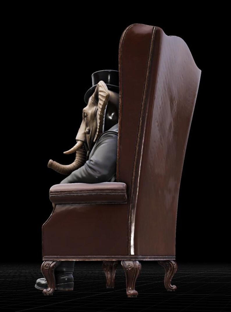 Puede incluir: Un sill&oacute;n de cuero marr&oacute;n con respaldo alto y patas ornamentadas. Sentada en el sill&oacute;n, una figura con cabeza de elefante, vestida con traje negro y sombrero de copa. La figura mira hacia la izquierda, con su trompa visible.
