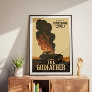 May include: A vintage-style poster for the movie "The Godfather" directed by Francis Ford Coppola. The poster features a black car driving through a field with smoke and flames in the background. The text "The Godfather" is in large, bold letters.