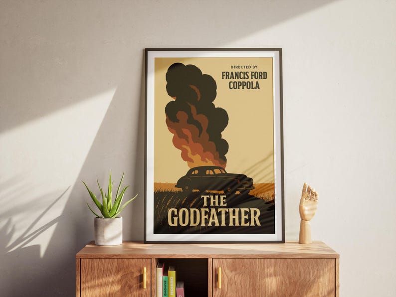 May include: A vintage-style poster for the movie "The Godfather" directed by Francis Ford Coppola. The poster features a black car driving through a field with smoke and flames in the background. The text "The Godfather" is in large, bold letters.