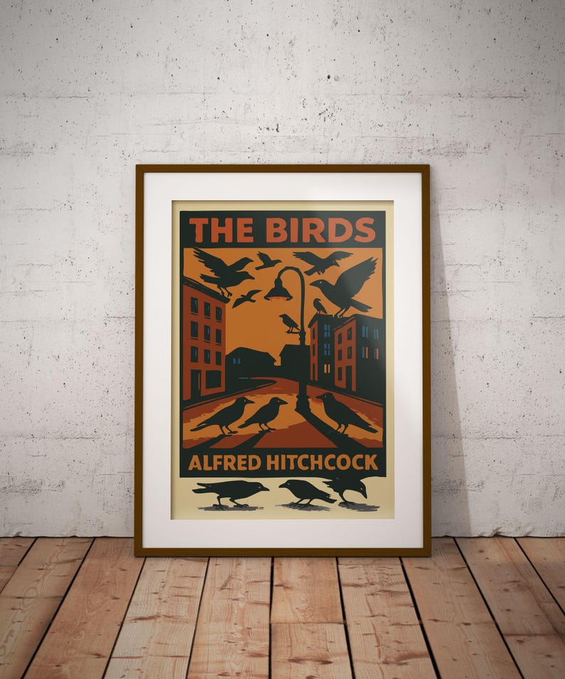 May include: A vintage-style poster for the Alfred Hitchcock film "The Birds". The poster features a black and white illustration of a city street with birds flying overhead and perched on buildings. The text "The Birds" is in red and the text "Alfred Hitchcock" is in black.