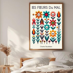 May include: A colorful poster with the title "LES FLEURS DU MAL" by Charles Baudelaire. The poster features a stylized design of flowers with skulls in the center of each flower.