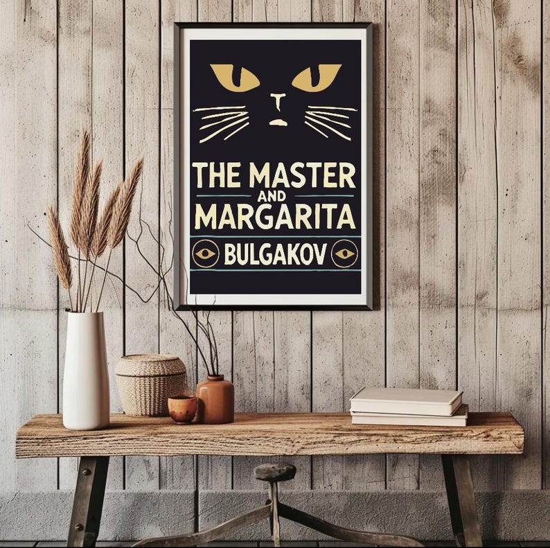 May include: A black and white poster featuring a stylised cat face and the text "THE MASTER AND MARGARITA BULGAKOV" in yellow lettering.