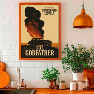 May include: A vintage-style poster for the movie "The Godfather" directed by Francis Ford Coppola. The poster features a black car engulfed in flames with smoke rising from the hood. The text "The Godfather" is in large, bold letters below the car.