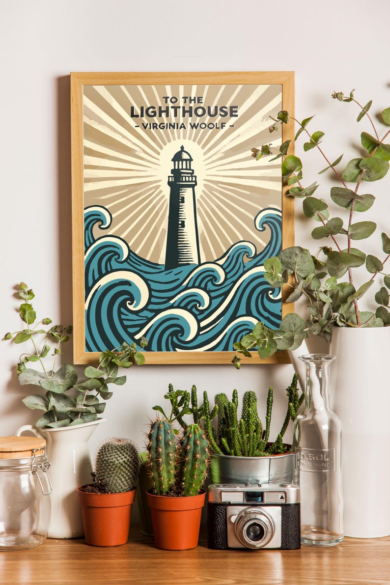 May include: A framed print of a lighthouse with waves crashing around it. The print has the title "To the Lighthouse - Virginia Woolf -" at the top. The print is surrounded by plants and a camera.