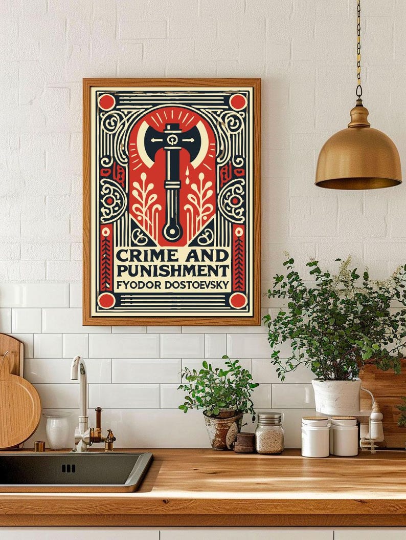 Op de afbeelding: Een ingelijste poster met een rood, wit en zwart ontwerp. De poster toont een bijl met een rode steel en een zwarte kling. De tekst "CRIME AND PUNISHMENT" is in zwarte letters op een witte achtergrond geschreven. De tekst "FYODOR DOSTOYEVSKY" is in zwarte letters op een rode achtergrond geschreven.