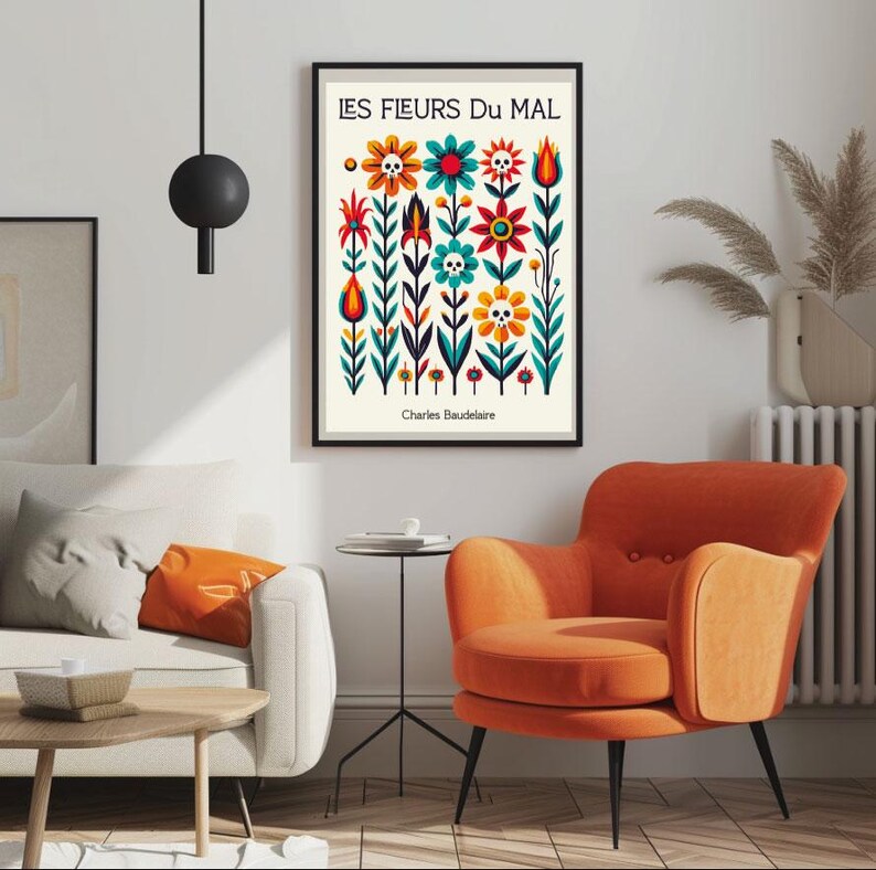 May include: A black framed poster with a white background featuring a colorful illustration of flowers with skulls. The title of the poster is "LES FLEURS DU MAL" by Charles Baudelaire.