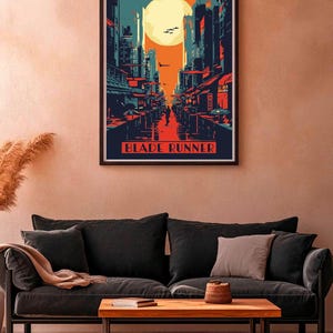 May include: A retro-style poster with a cityscape illustration in shades of blue, red, and orange. The poster features a large, yellow moon and the text "Blade Runner".