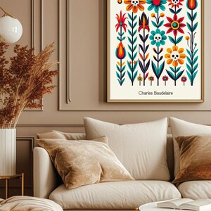 May include: A framed print of a colorful floral design with skulls in the flowers. The title of the print is "LES FLEURS DU MAL" by Charles Baudelaire.