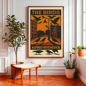 May include: A vintage-style poster for the Alfred Hitchcock film "The Birds". The poster features a black and white illustration of birds flying over a city street with buildings in the background. The text "The Birds" is in large, bold letters at the top of the poster, and "Alfred Hitchcock" is in smaller letters at the bottom.