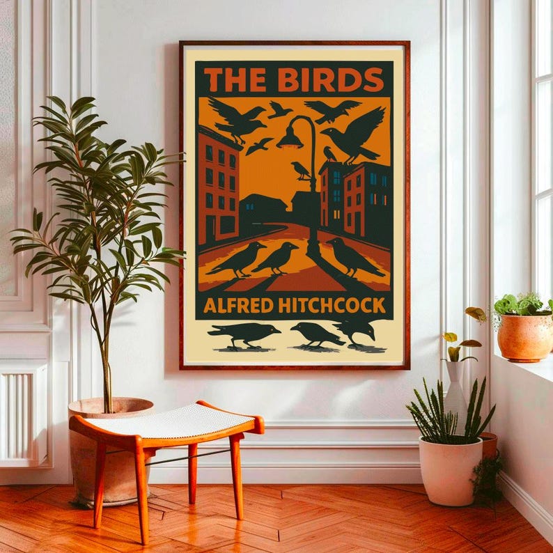 May include: A vintage-style poster for the Alfred Hitchcock film "The Birds". The poster features a black and white illustration of birds flying over a city street with buildings in the background. The text "The Birds" is in large, bold letters at the top of the poster, and "Alfred Hitchcock" is in smaller letters at the bottom.