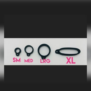 May include: Four black rubber rings of different sizes labelled "SM", "MED", "LRG", and "XL".