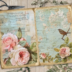 Op de afbeelding: Een vintage-stijl dagboek met een blauwe en witte achtergrond. Het dagboek heeft handschrift en een vogel illustratie. De voorkant heeft een bloemmotief met roze rozen en groene bladeren.