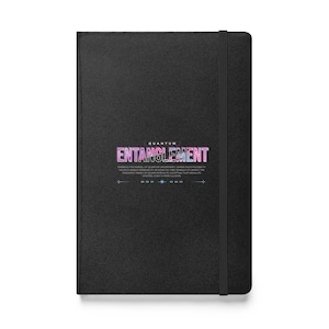 May include: Black notebook with a textured cover and a black elastic band closure. The front cover features the text "QUANTUM ENTANGLEMENT" in pink and blue with a gradient effect. The text is surrounded by a white border and a line of small white stars.
