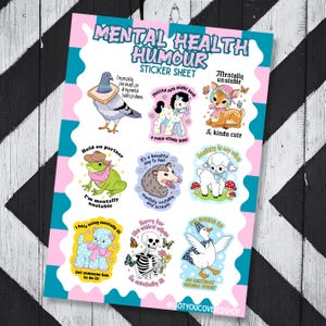 May include: A sticker sheet titled Mental Health Humour featuring nine illustrations: a pigeon with bread, a pony, a fawn, a frog in a hat, an opossum, a lamb with mushrooms, a blue cat, a skeleton with flowers, and a duck wearing a party hat.
