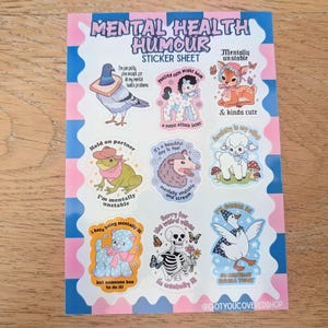 May include: A sticker sheet titled Mental Health Humour featuring nine illustrations including a pigeon with bread, a pony, a fawn, a frog in a hat, an opossum, a lamb, a blue cat, a skeleton, and a goose, all with text captions.