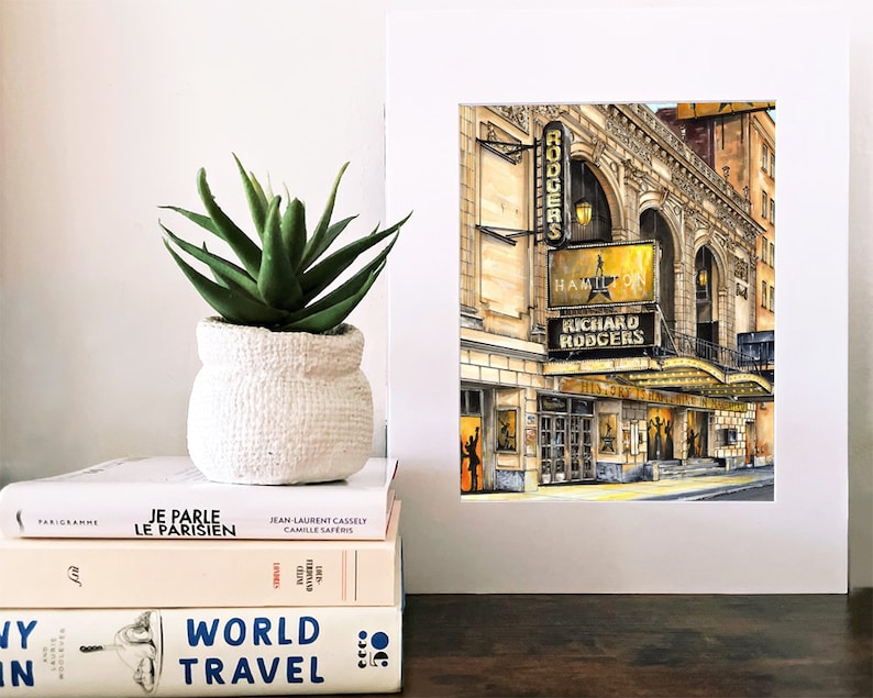 May include: A watercolor painting of the Richard Rodgers Theatre in New York City. The marquee reads "Hamilton" and "Richard Rodgers".