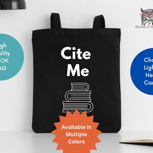 May include: Black tote bag with white text that reads "Cite Me" and a stack of books graphic. The bag is available in multiple colors and can be made with light or heavy canvas.