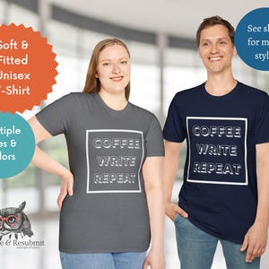May include: Two people wearing gray and navy blue t-shirts with the text "Coffee Write Repeat" in a white box. The shirts are soft and fitted.