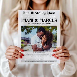 May include: A newspaper-style wedding announcement held by a person. The headline reads "IMANI & MARCUS ARE GETTING MARRIED." The announcement includes a photo of the couple and text that reads "DEAR FAMILY & FRIENDS" and "JOIN US IN CELEBRATING A UNION OF LOVE, LAUGHTER AND HAPPINESS."
