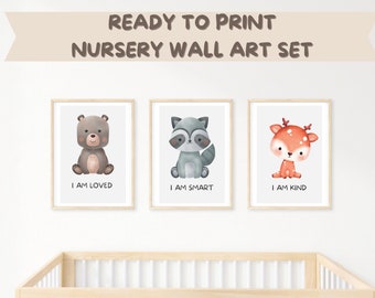 May include: Set of three printable nursery wall art prints featuring watercolor illustrations of a bear, raccoon, and deer. Each print includes a positive affirmation: "I am loved", "I am smart", and "I am kind".