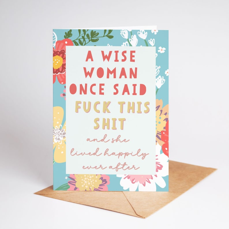 May include: A greeting card with a floral design and the text "A WISE WOMAN ONCE SAID FUCK THIS SHIT and she lived happily ever after." The card is on a brown envelope.