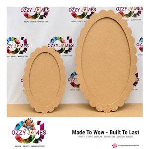 May include: Two light brown oval-shaped wooden plaques with scalloped edges. The plaques feature a smooth, flat surface and are displayed in two different sizes, with the larger one positioned to the right of the smaller one on a flat surface.