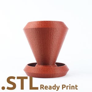 May include: A textured, reddish-brown, 3D-printed object with a conical top and a circular base. The object has a geometric design and the text ".STL Ready Print" is visible at the bottom.