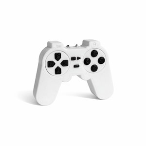 May include: A white games controller with black buttons and a directional pad. The controller has a classic design with a central button cluster and shoulder buttons. The controller is a solid, 3D-printed object.