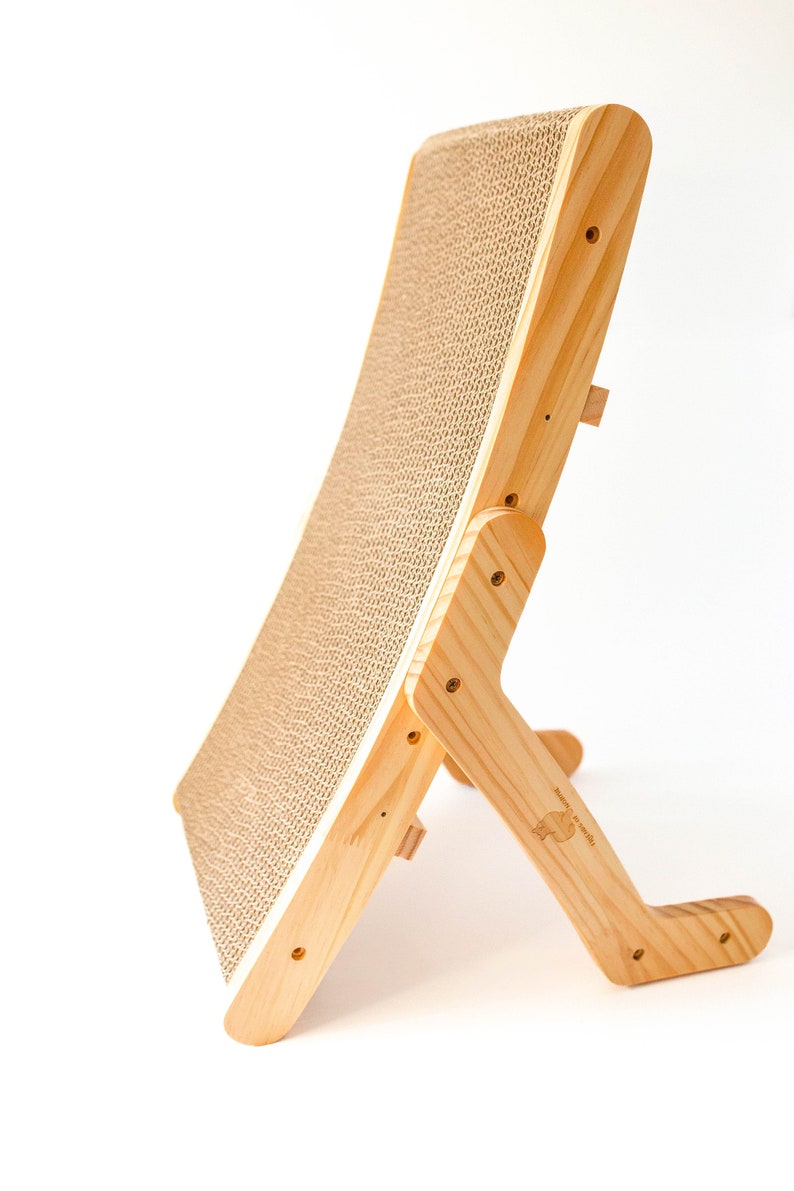 Wooden cat scratcher standing upright on a white background